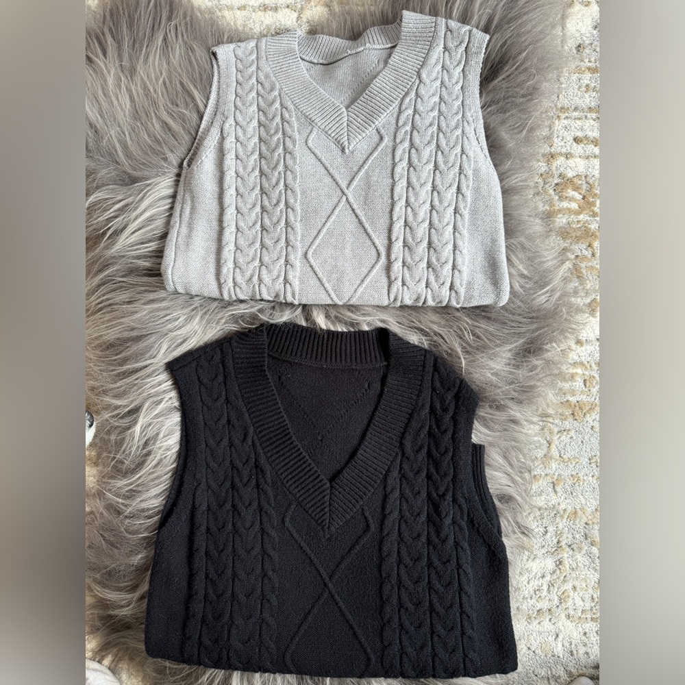 Adorable oversized black and gray women’s sweater vests.